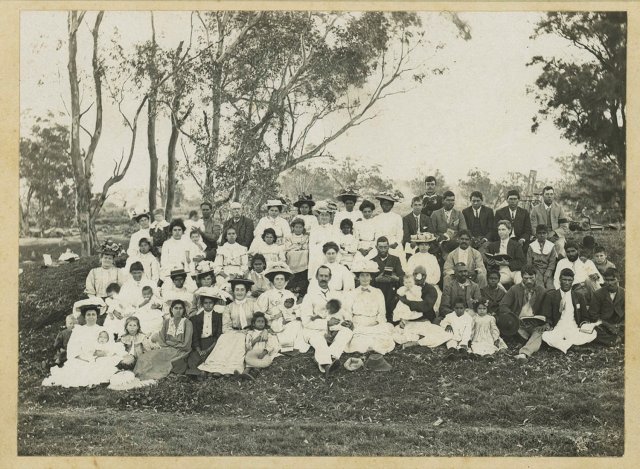 Group of Aboriginal men, women and children at Singleton, 1909. SLNSW